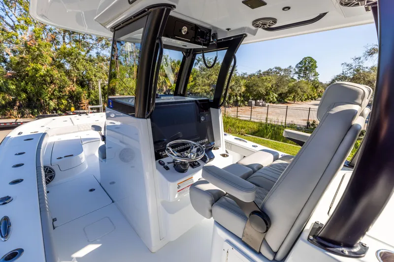 Slide: The Image of 2024 Freeman 28 boat interior with modern helm and seating. - 22