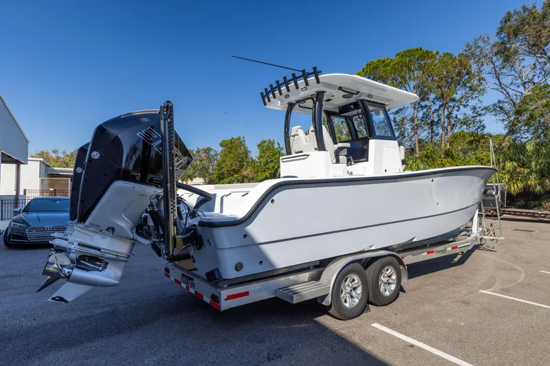 Slide: The Image of 2024 Freeman 28 boat on trailer in parking lot, side view. - 8