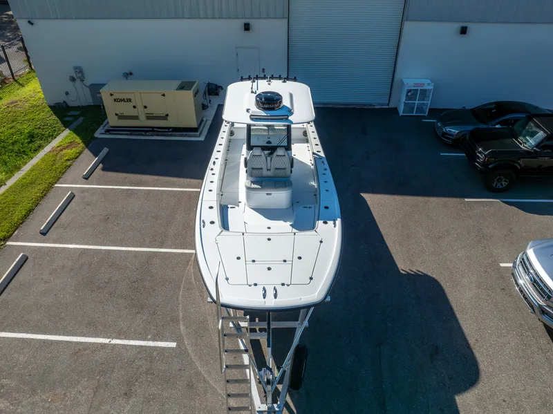 Slide: The Image of 2024 Freeman 28 boat parked in a lot, aerial view. - 9