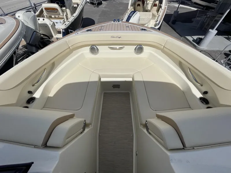 Slide: The Image of 2025 Chris-Craft Calypso 28 boat interior with beige seating and elegant design. - 15