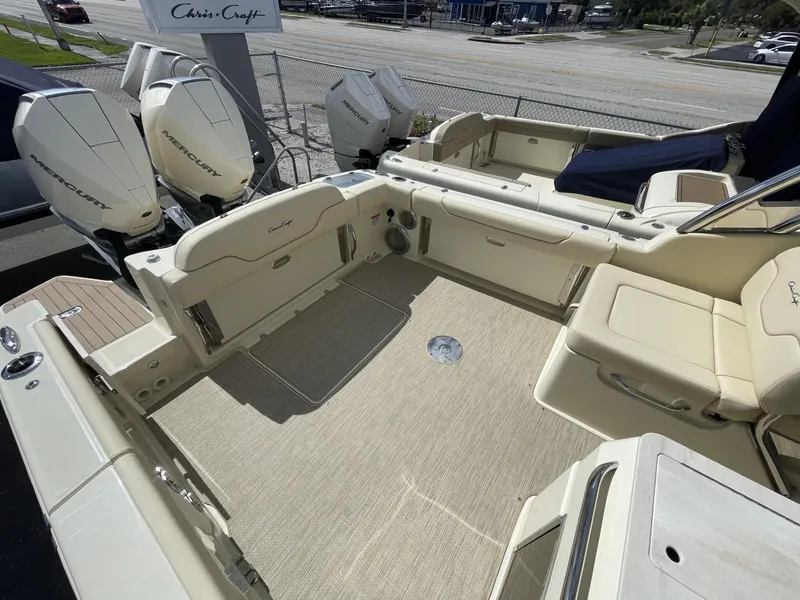 Slide: The Image of 2025 Chris-Craft Calypso 28 boat interior with seating and twin outboard engines. - 5
