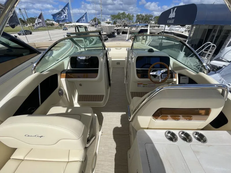 Slide: The Image of 2025 Chris-Craft Calypso 28 boat interior with luxurious seating and modern dashboard. - 8