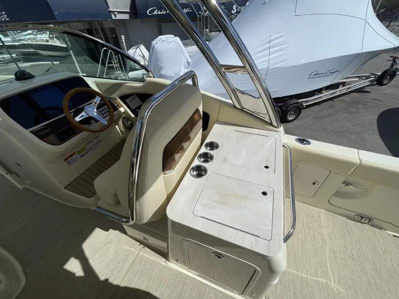 Slide: The Image of 2025 Chris-Craft Calypso 28 boat interior with helm and seating area. - 9