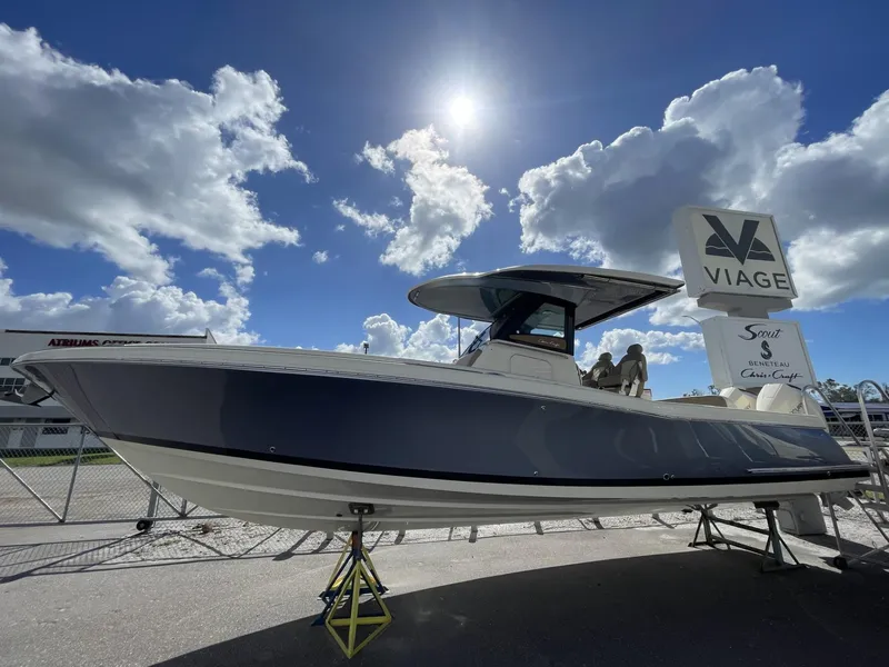 Slide: The Image of 2025 Chris-Craft Catalina 30 boat displayed outdoors under a bright blue sky. - 1