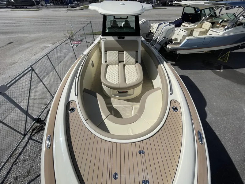 Slide: The Image of 2025 Chris-Craft Catalina 30 boat with elegant seating and teak deck. - 14