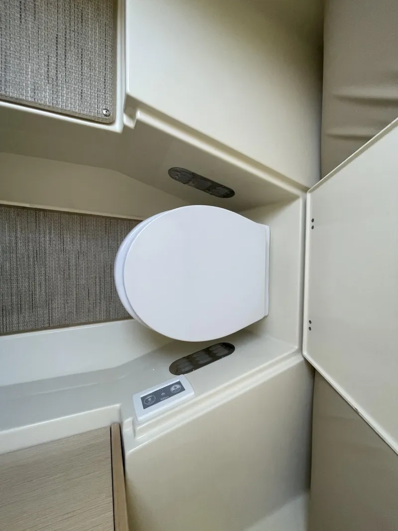 Slide: The Image of 2025 Chris-Craft Catalina 30 boat interior bathroom with modern toilet design. - 16