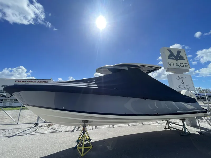 Slide: The Image of 2025 Chris-Craft Catalina 30 boat displayed outdoors under a bright blue sky. - 2