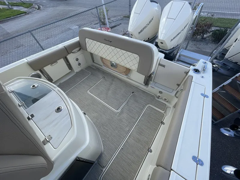 Slide: The Image of 2025 Chris-Craft Catalina 30 boat interior with luxurious seating and twin Mercury engines. - 4