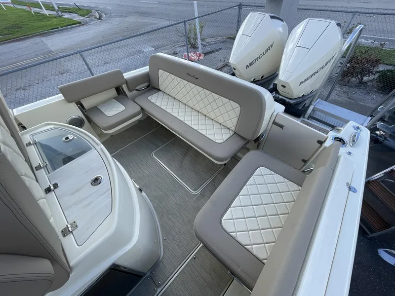 Slide: The Image of 2025 Chris-Craft Catalina 30 boat interior with luxurious seating and dual Mercury engines. - 5