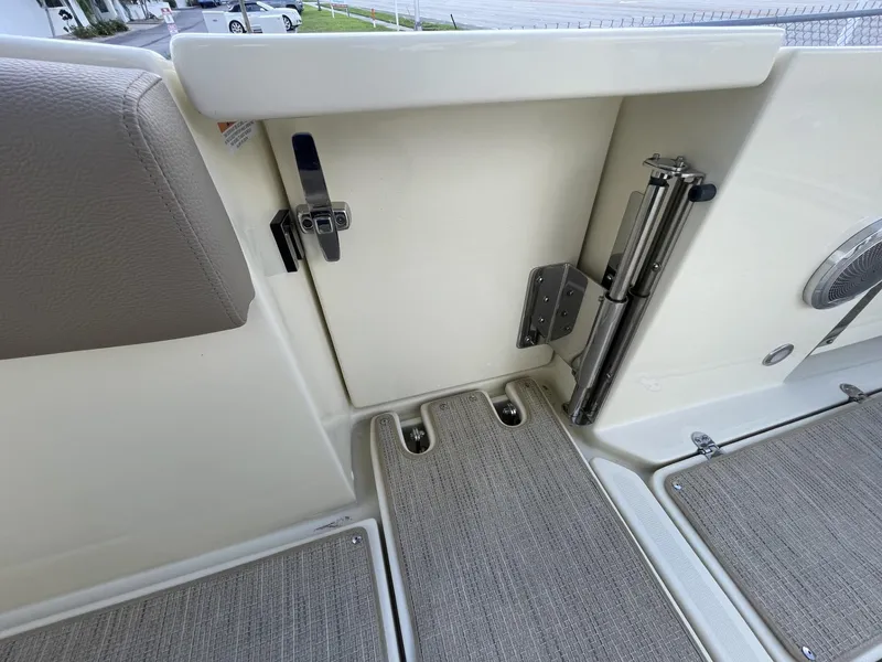 Slide: The Image of 2025 Chris-Craft Catalina 30 interior detail with seating and storage compartment. - 6