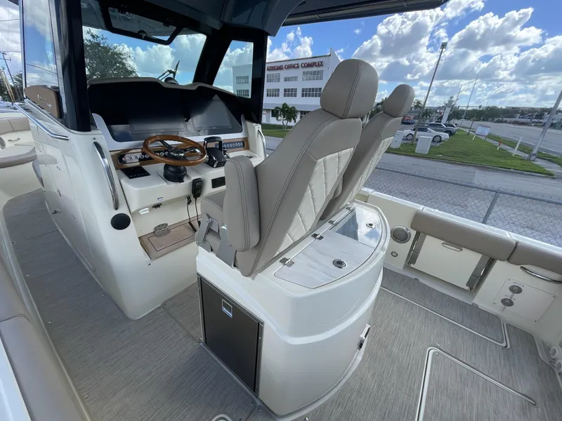 Slide: The Image of 2025 Chris-Craft Catalina 30 boat interior with helm and seating. - 7
