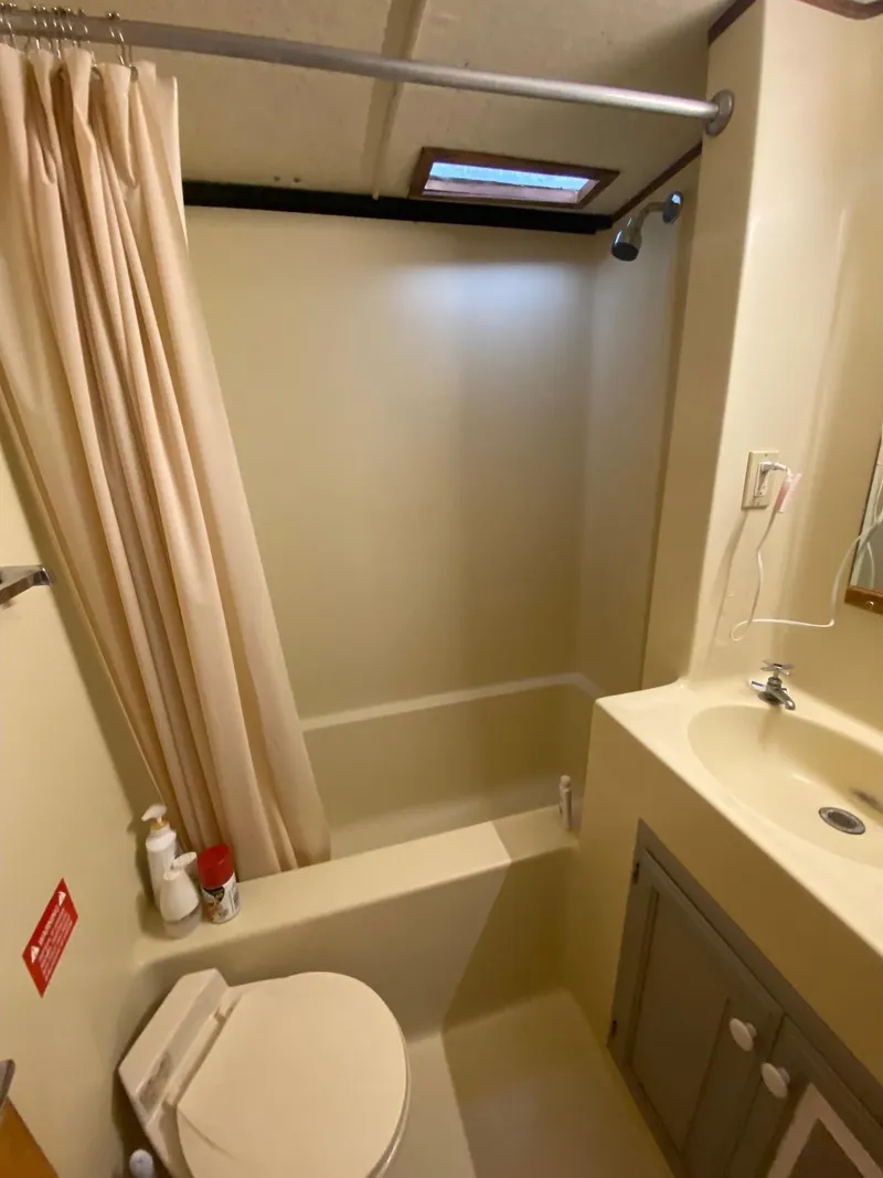 Slide: The Image of Compact bathroom in 1988 Boatel Hercules with shower, sink, and toilet. - 8