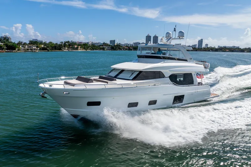 Slide: The Image of 2021 Ocean Alexander 70E Motoryacht cruising on a sunny day. - 1