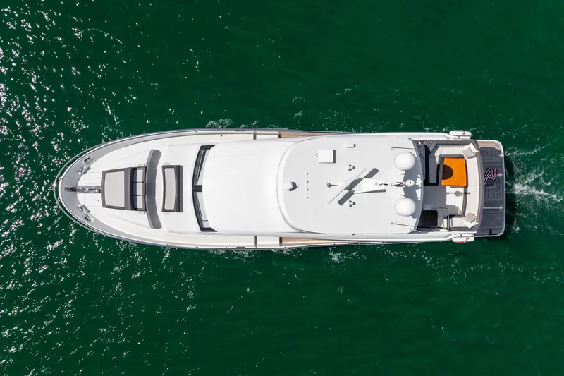 Slide: The Image of Aerial view of 2021 Ocean Alexander 70E Motoryacht on green water. - 14