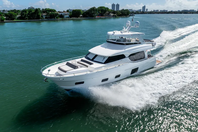Slide: The Image of 2021 Ocean Alexander 70E Motoryacht cruising on a sunny day. - 2