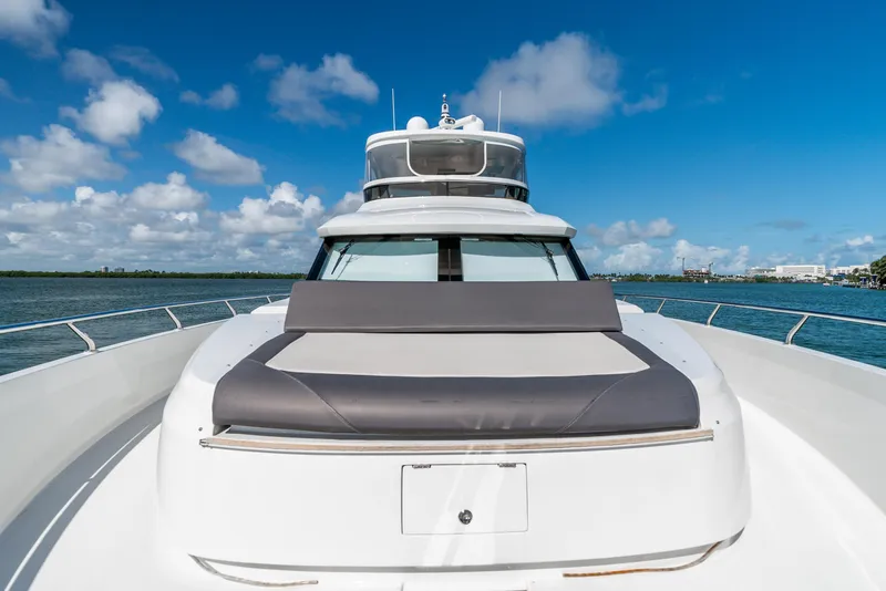 Slide: The Image of 2021 Ocean Alexander 70E Motoryacht on open water under blue sky. - 24