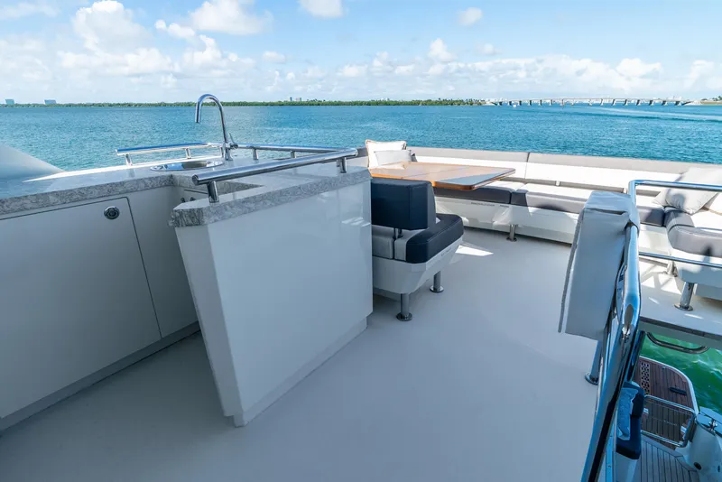 Slide: The Image of Luxurious 2021 Ocean Alexander 70E Motoryacht deck with seating and ocean view. - 25