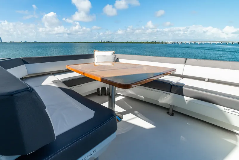 Slide: The Image of Luxurious seating area on 2021 Ocean Alexander 70E Motoryacht with ocean view. - 26