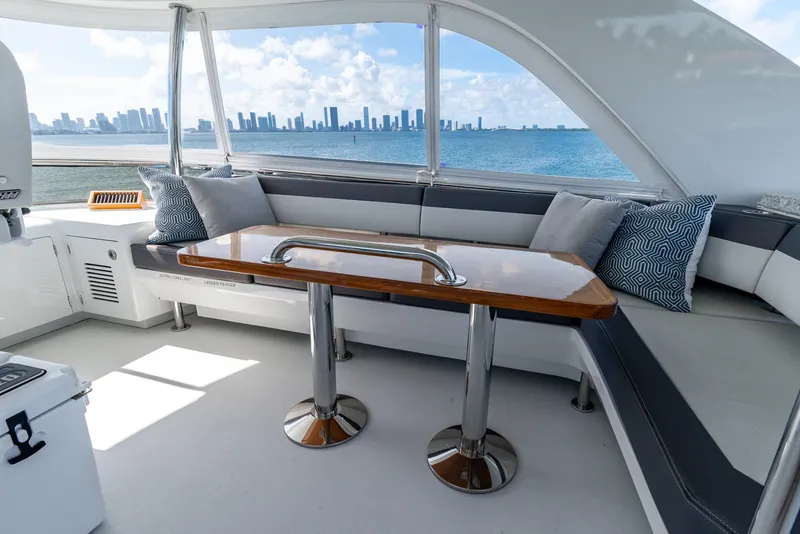 Slide: The Image of Luxurious 2021 Ocean Alexander 70E Motoryacht interior with ocean view and elegant seating area. - 30