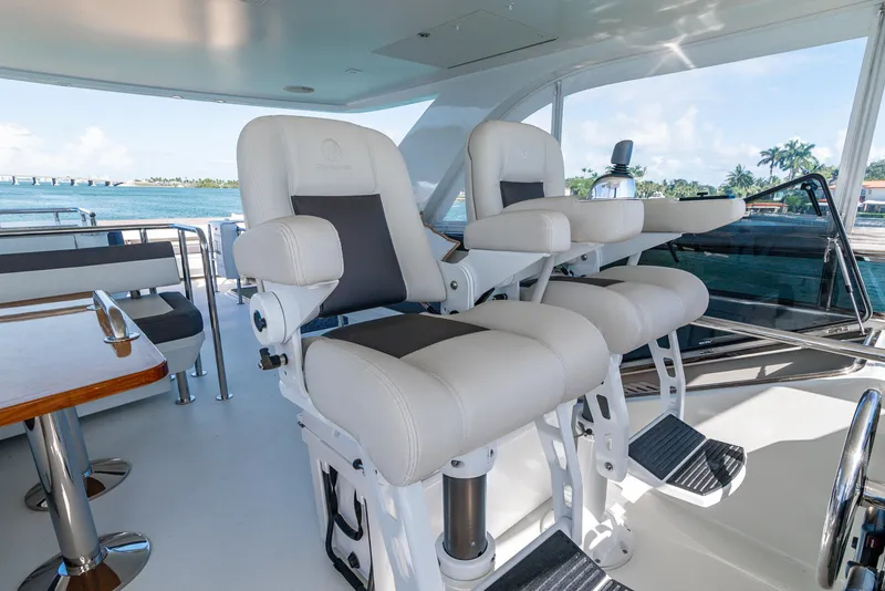 Slide: The Image of Luxurious helm chairs on 2021 Ocean Alexander 70E Motoryacht with ocean view. - 31