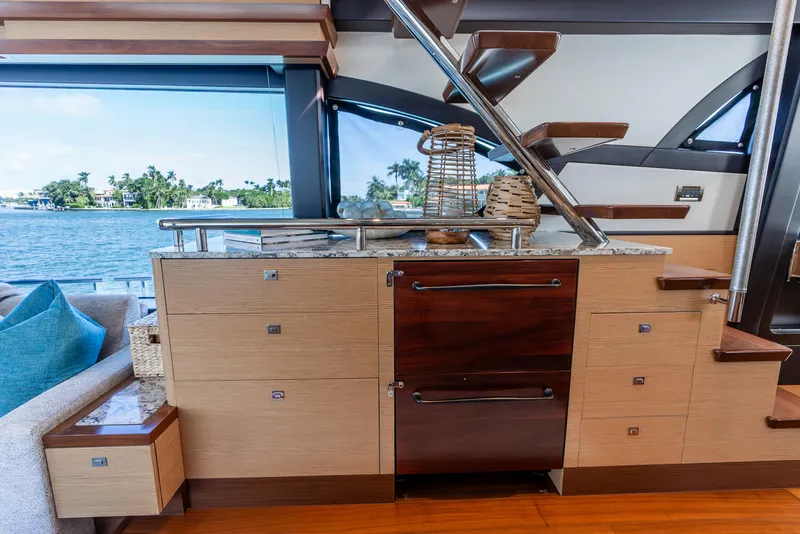 Slide: The Image of Luxurious interior of 2021 Ocean Alexander 70E Motoryacht with modern cabinetry and staircase. - 38