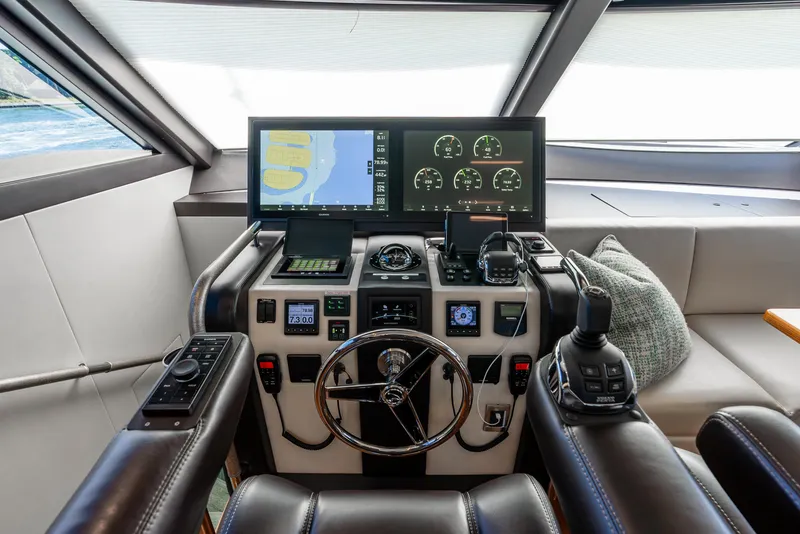 Slide: The Image of 2021 Ocean Alexander 70E Motoryacht helm with advanced navigation controls and displays. - 47