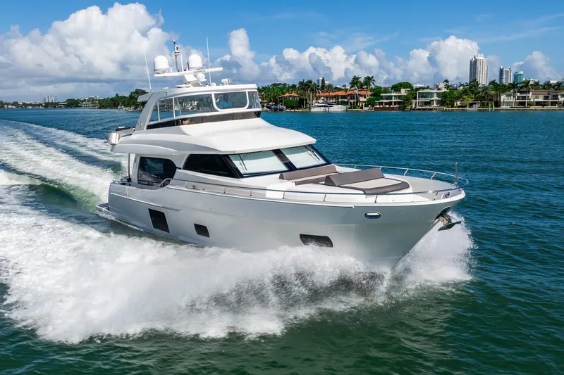 Slide: The Image of 2021 Ocean Alexander 70E Motoryacht cruising on a sunny day. - 5