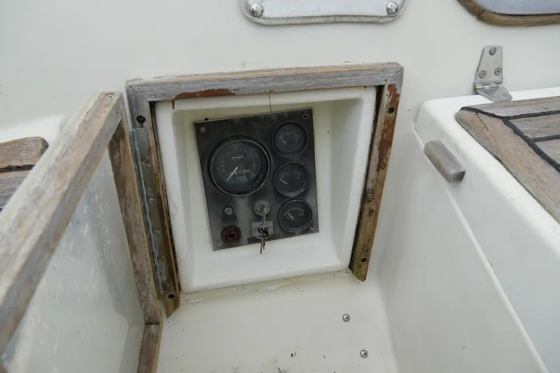 Slide: The Image of Control panel of a 1980 Lafitte 44 Cutter sailboat, featuring vintage gauges and switches. - 15