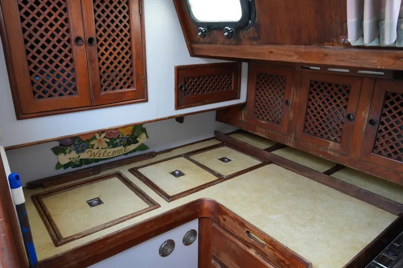 Slide: The Image of Interior of 1980 Lafitte 44 Cutter with wooden cabinets and countertop. - 32