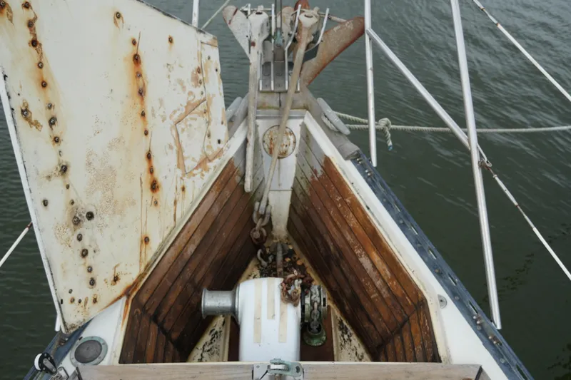 Slide: The Image of Bow of 1980 Lafitte 44 Cutter sailboat with anchor and winch. - 6