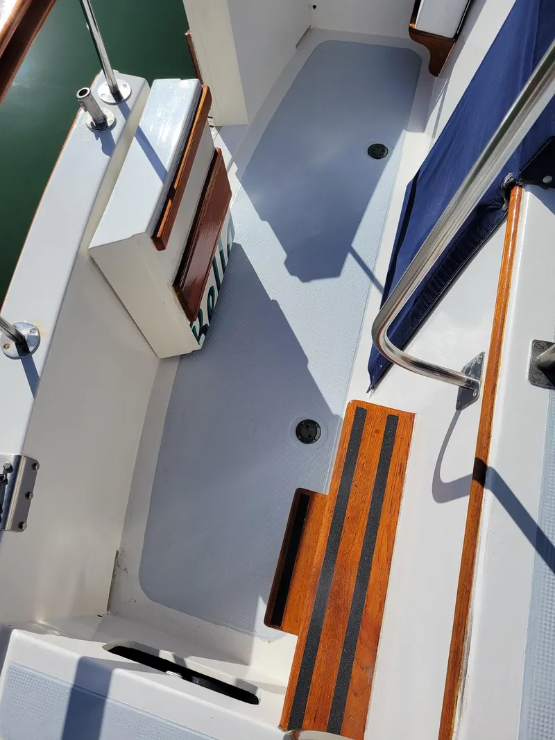 Slide: The Image of 1981 Roughwater 41 Pilot House deck with wood accents and railing. - 11