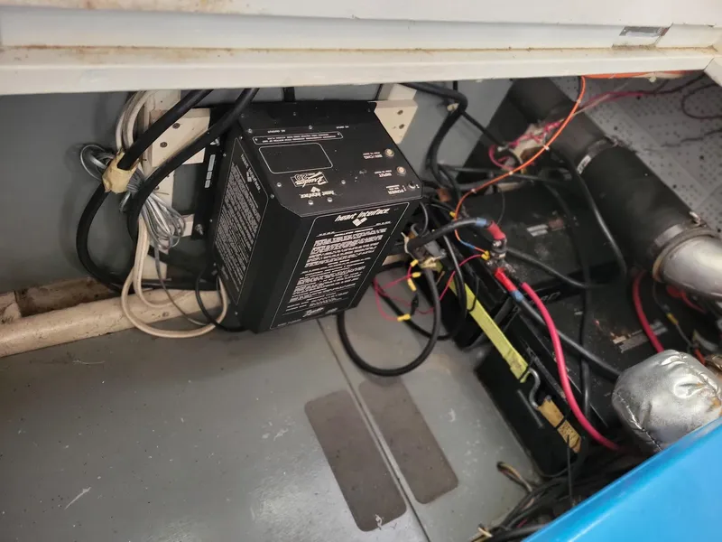 Slide: The Image of Electrical system inside 1981 Roughwater 41 Pilot House boat, featuring wiring and components. - 42