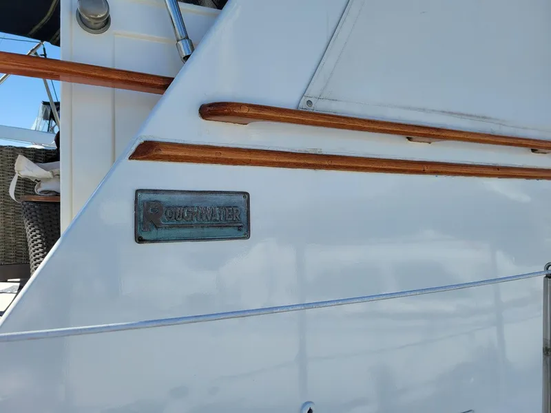 Slide: The Image of 1981 Roughwater 41 Pilot House boat with wooden trim and nameplate. - 6