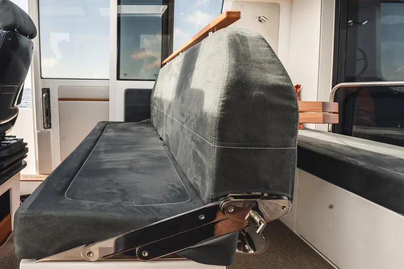 Slide: The Image of 2023 Nimbus Commuter 11 interior seating with sleek, modern design. - 13