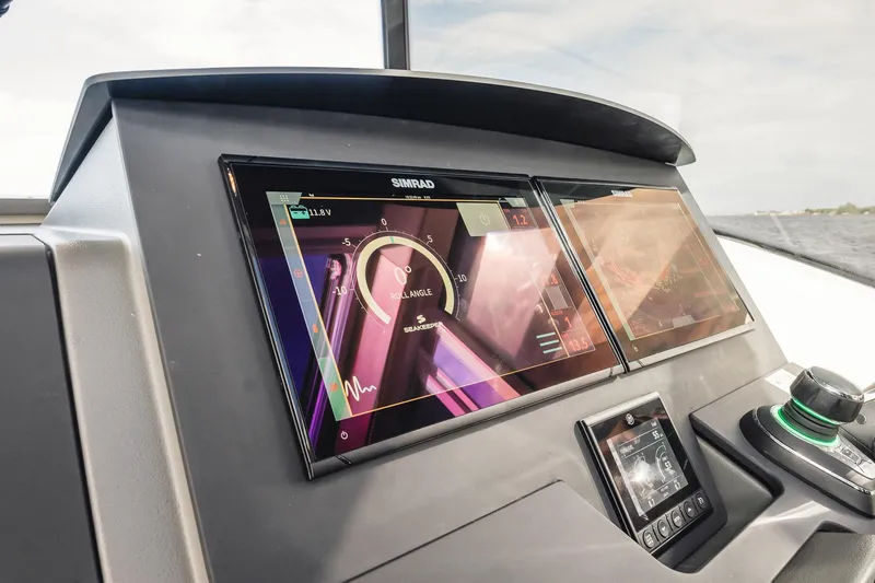 Slide: The Image of 2023 Nimbus Commuter 11 dashboard with advanced navigation displays. - 21