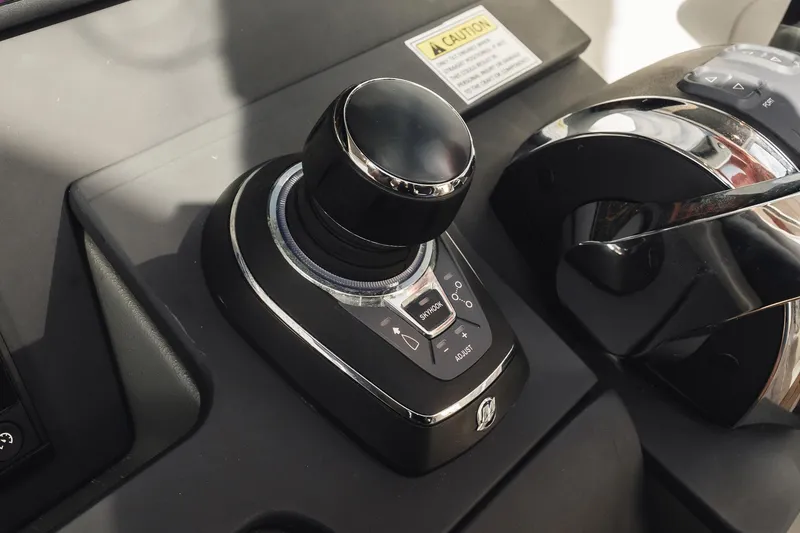 Slide: The Image of 2023 Nimbus Commuter 11 control panel with joystick and throttle. - 22