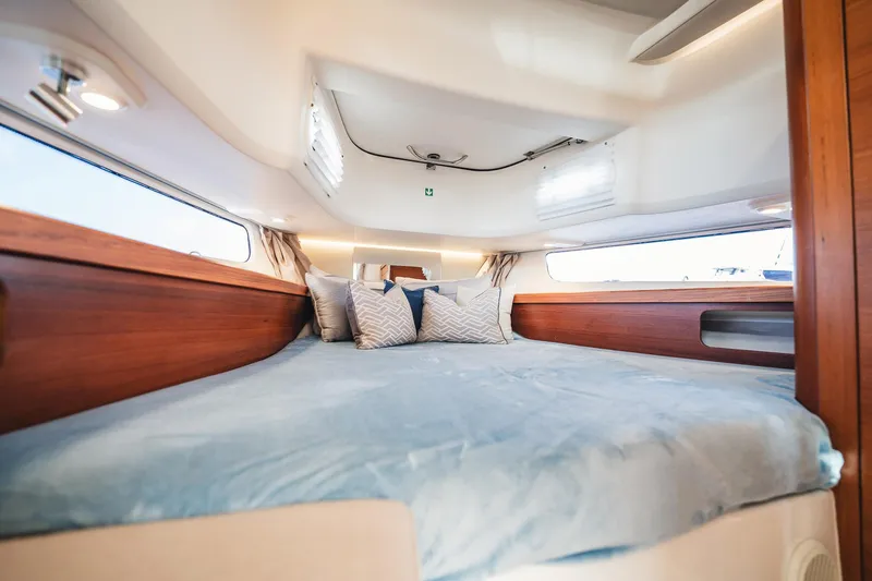 Slide: The Image of Luxurious cabin interior of 2023 Nimbus Commuter 11 with cozy bedding. - 32