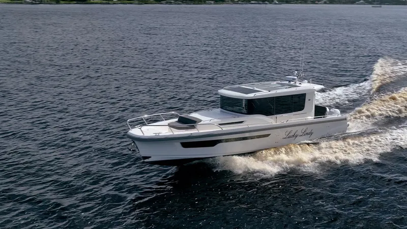 Slide: The Image of Nimbus Commuter 11 boat cruising on open water, 2023 model. - 43