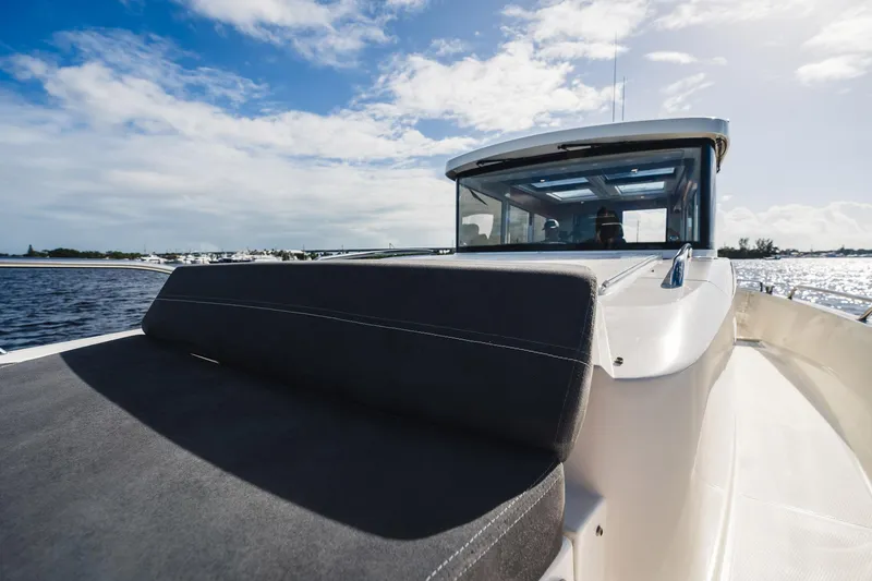 Slide: The Image of 2023 Nimbus Commuter 11 boat on water under blue sky. - 46