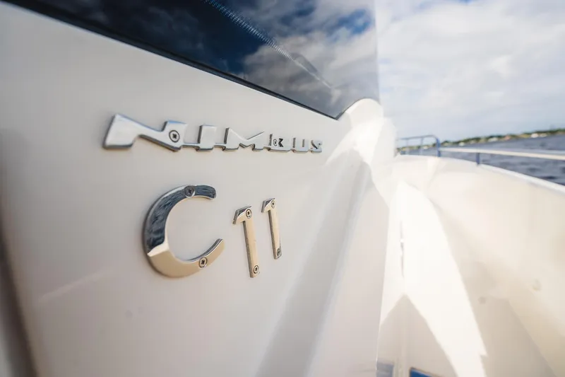 Slide: The Image of 2023 Nimbus Commuter 11 boat, close-up of logo and model name. - 49