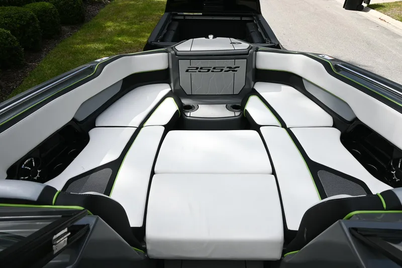 Slide: The Image of 2021 Yamaha Boats 255XD interior with white seating and sleek design. - 12