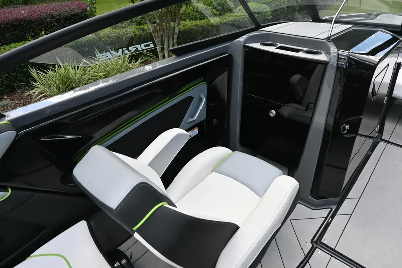 Slide: The Image of 2021 Yamaha Boats 255XD interior with sleek black and white seating, modern design. - 15