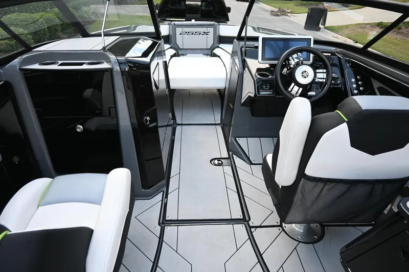 Slide: The Image of Interior of 2021 Yamaha Boats 255XD, featuring modern dashboard and seating. - 17