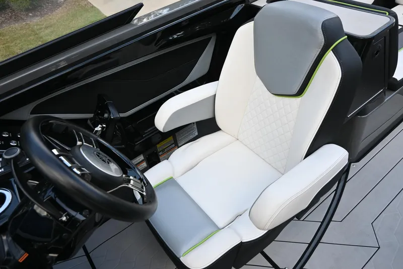 Slide: The Image of 2021 Yamaha Boats 255XD cockpit with modern steering and comfortable seating. - 19