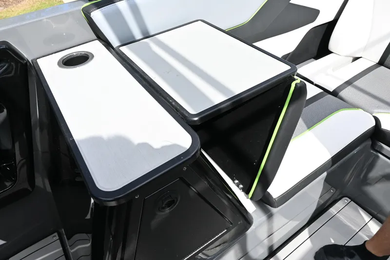 Slide: The Image of Interior of 2021 Yamaha Boats 255XD, featuring sleek seating and table design. - 20