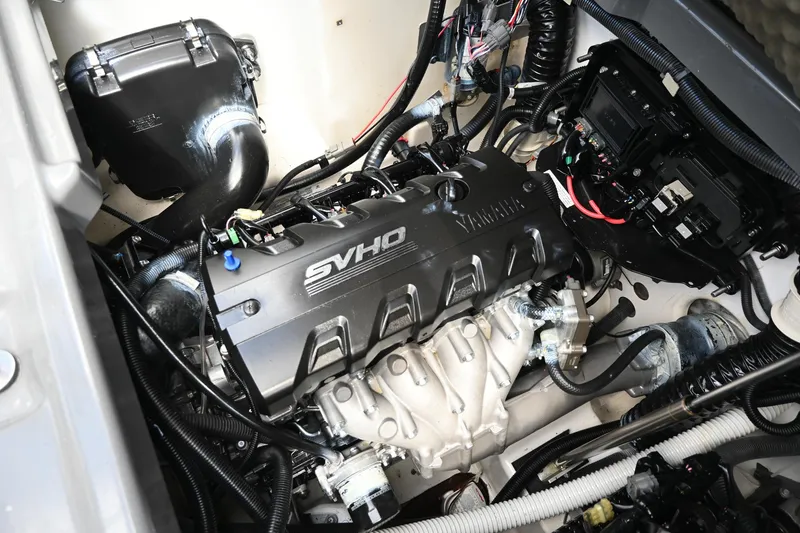 Slide: The Image of 2021 Yamaha Boats 255XD engine compartment with SVHO engine components. - 28