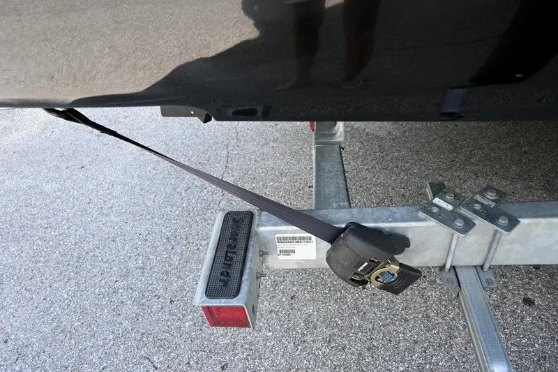 Slide: The Image of Yamaha Boats 2021 255XD trailer with secure strap and hitch detail. - 42