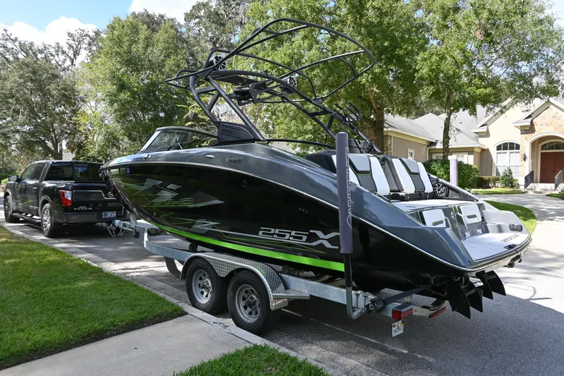 Slide: The Image of 2021 Yamaha Boats 255XD on trailer, parked in suburban neighborhood. - 43