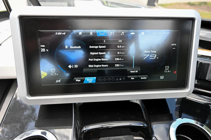 Slide: The Image of Yamaha Boats 255XD 2021 dashboard display showing speed, engine hours, and water temperature. - 6