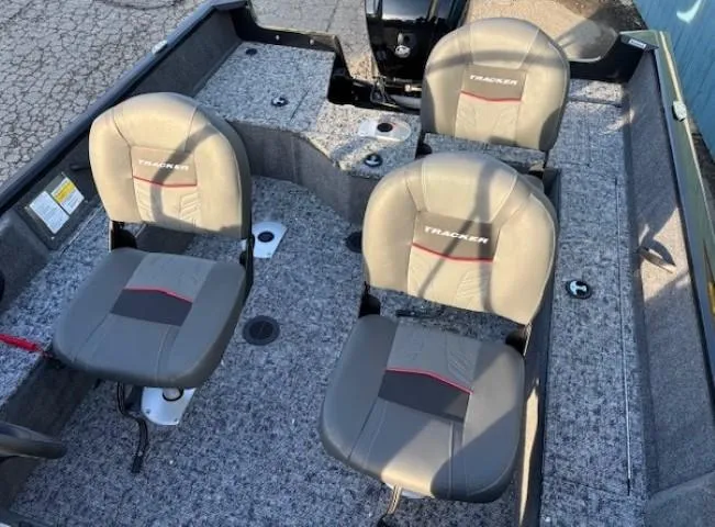 Slide: The Image of 2025 Tracker Pro Guide V-16 WT boat interior with four cushioned seats. - 10